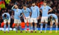 Manchester City’s players react as their side exit the Champions League on penalties to Real Madrid