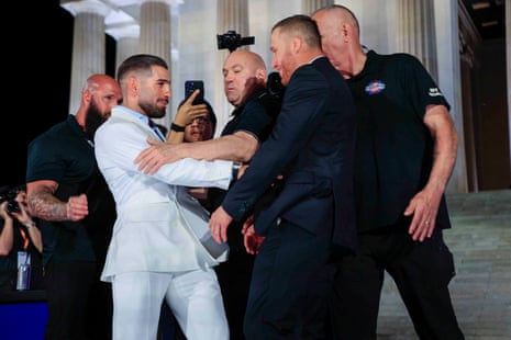UFC president Dana White (center) separates Ilia Topuria (left) and Justin Gaethje (right) during a press conference at the Lincoln Memorial in Washington on Friday. Topuria and Gaethje are scheduled to meet in the main event of UFC Freedom 250.