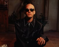 Portrait of Michael Stipe wearing sunglasses in 1995