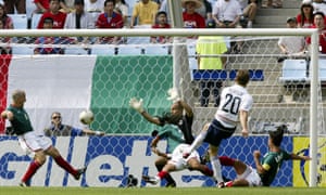 Brian McBride scores the opener against Mexico