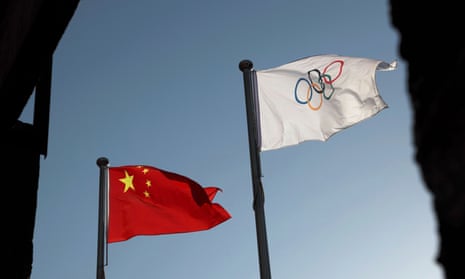The Chinese and Olympic flags  at the headquarters of the Beijing organising committee for the 2022 Olympic and Paralympic Winter Games in Beijing.