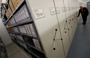 A civil servant opens one of the file galleries