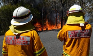 Firefighters monitor a back burn near Mount Victoria in the Blue Mountains on October 21, 2013. The intense Australian summer heat was made 5 times more likely by human-caused global warming.