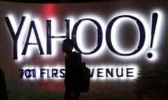 FILE - In this Nov. 5, 2014, file photo, a person walks in front of a Yahoo sign at the company’s headquarters in Sunnyvale, Calif. Verizon bought Yahoo in a sale announced Monday, July 25, 2016. (AP Photo/Marcio Jose Sanchez, File)