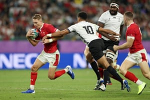 Liam Williams of Wales breaks past Ben Volavola of Fiji to go on and score his team???s fourth try.