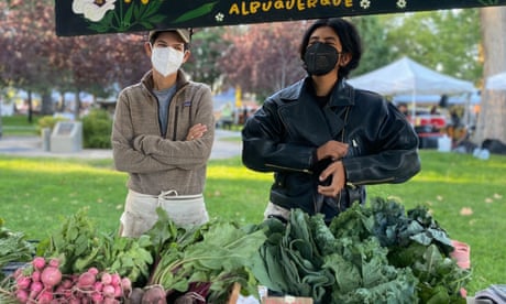Ash Abeyta and Mallika Singh pose with their harvest from Ashokra farm, a vegetable farm owned by queer and trans people of color.
