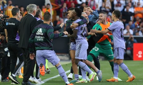 Real Madrid's Vinicius Junior, center, leaves the pitch after being shown a red card during a Spanish La Liga soccer match between Valencia and Real Madrid, at the Mestalla stadium in Valencia, Spain, Sunday, May 21, 2023. (AP Photo/Alberto Saiz)