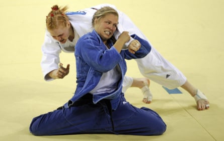 United States’ Ronda Rousey (blue) and Germany’s Annett Boehm compete in their women’s -70kg judo bronze medal match of the 2008 Beijing Olympic Games.