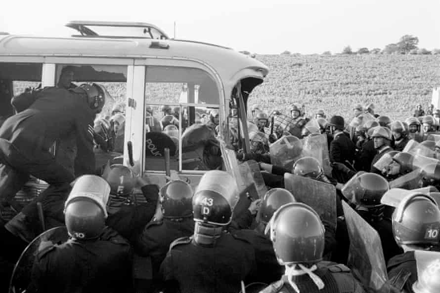 Unrest at Stonehenge... police stop a bus.