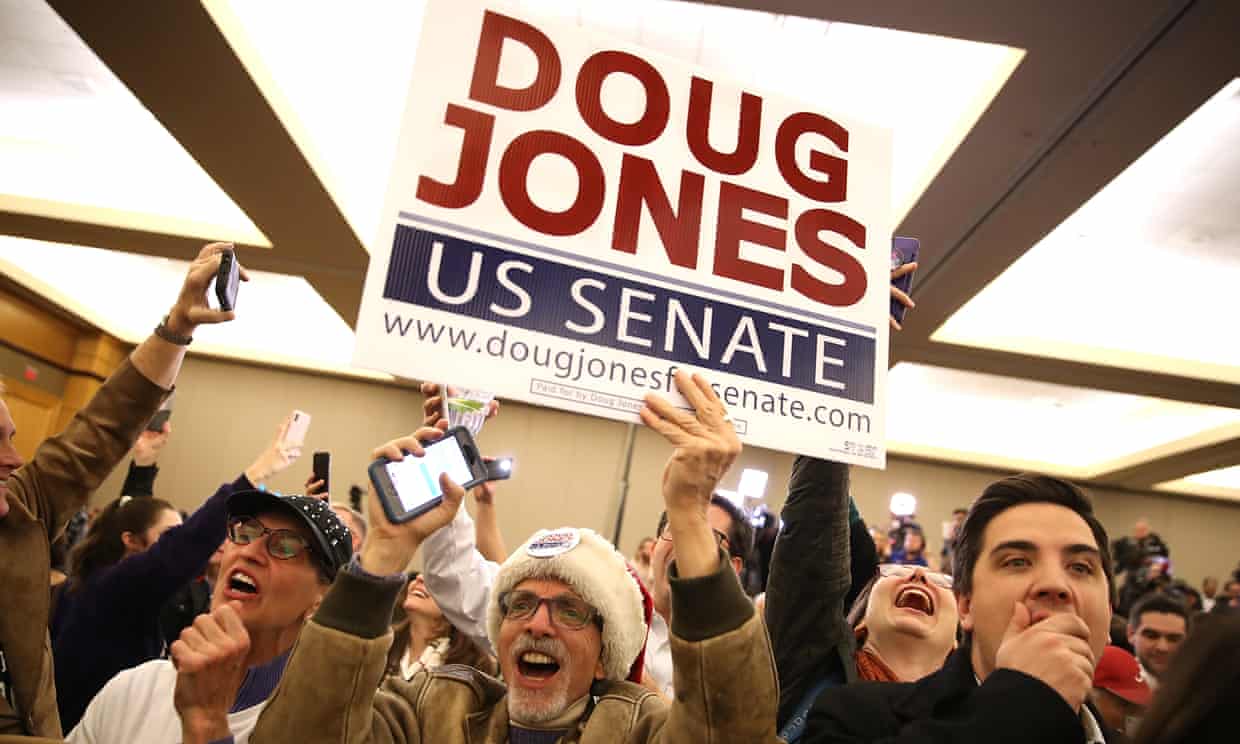 Supporters celebrate as Doug Jones is declared the winner during his election night gathering.