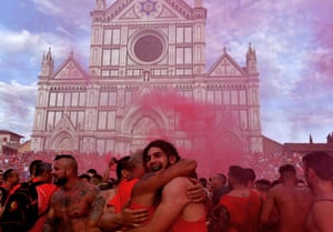 Red Team players celebrate at the end of the final match on Piazza Santa Croce in Florence