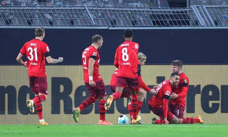 Ellyes Skhiri is mobbed by his teammates after scoring Köln’s decisive second goal