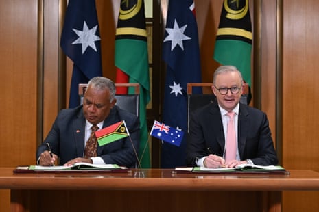 The prime minister of Vanuatu, Jotham Napat (left), and Australian prime minister, Anthony Albanese, sign the Nakamal agreement at Parliament House in Canberra on Monday.