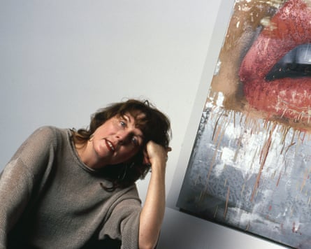woman props head up with hand next to painting of lips