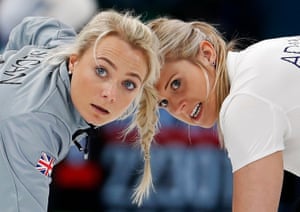 Great Britain’s Anna Sloan and Vicki Adams sweep in the women’s round robin curling match against Russia.