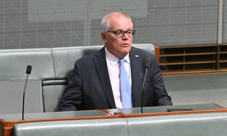 Former prime minister Scott Morrison  sitting in the House of Representatives at Parliament House in Canberra