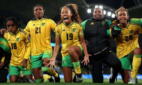 Tiernny Wiltshire of Jamaica celebrates with her team-mates after the Reggae Girlz secured a 0-0 draw with Brazil to reach the last 16.