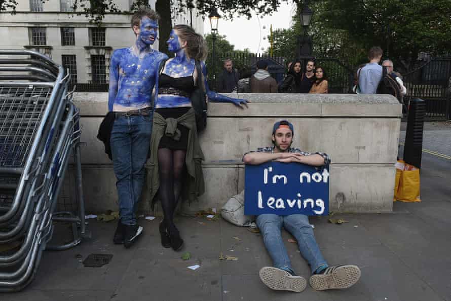 A young couple painted as EU flags protest outside Downing Street against the UK’s decision to leave the EU following the referendum the day before. 25 June 2016.