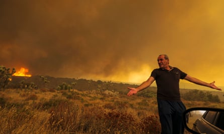 Mike Gregoryan frustrated as he asked to leave his home on Cruthers Creek as Bobcat fire reaches rages in Juniper Hills, Little Rock, California, earlier this month.