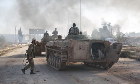 Syrian rebels attack an Assad regime-controlled military academy during an operation to break the siege in Aleppo on Sunday.