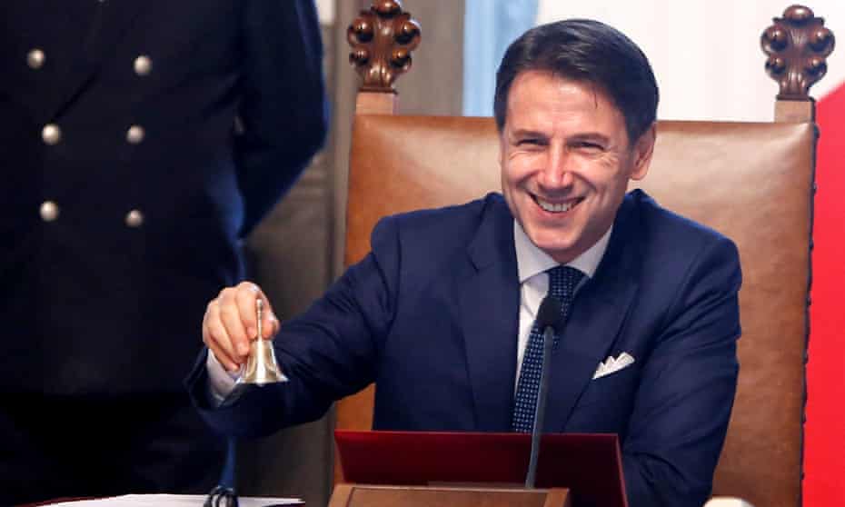 The Italian PM, Giuseppe Conte, rings a bell that traditionally opens the cabinet meeting at Chigi Palace in Rome