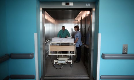 A patient being taken to an operating theatre in hospital