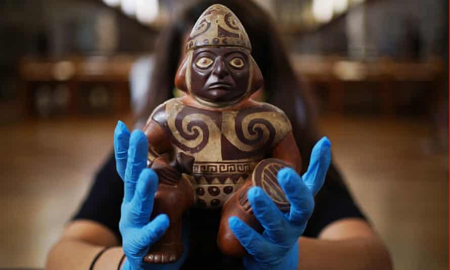 A painted pottery vessel in the form of a warrior holding a club and a shield was from the Moche, AD 100-600.