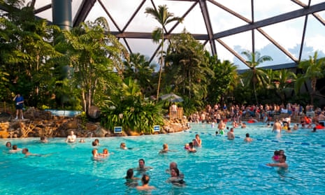 People swimming in the large domed pool at Center Parcs Sherwood Forest.