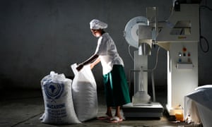 A woman bags macaroni at a food factory in Nazret, Ethiopia