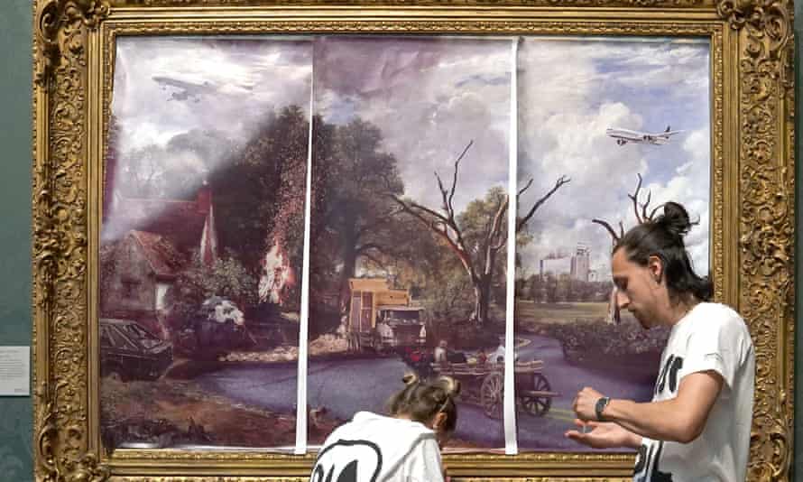 Just Stop Oil protesters cover John Constable’s The Hay Wain with their own picture.