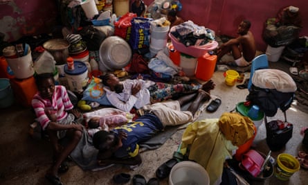 People displaced by gang violence live inside a classroom at Darius Denis school, in Port-au-Prince, Haiti