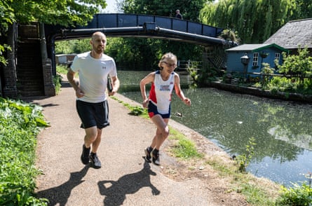 Ben Bloom and Sarah Roberts running along the canal