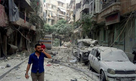 Residents in Aleppo inspect the damage from a rocket attack this week. 