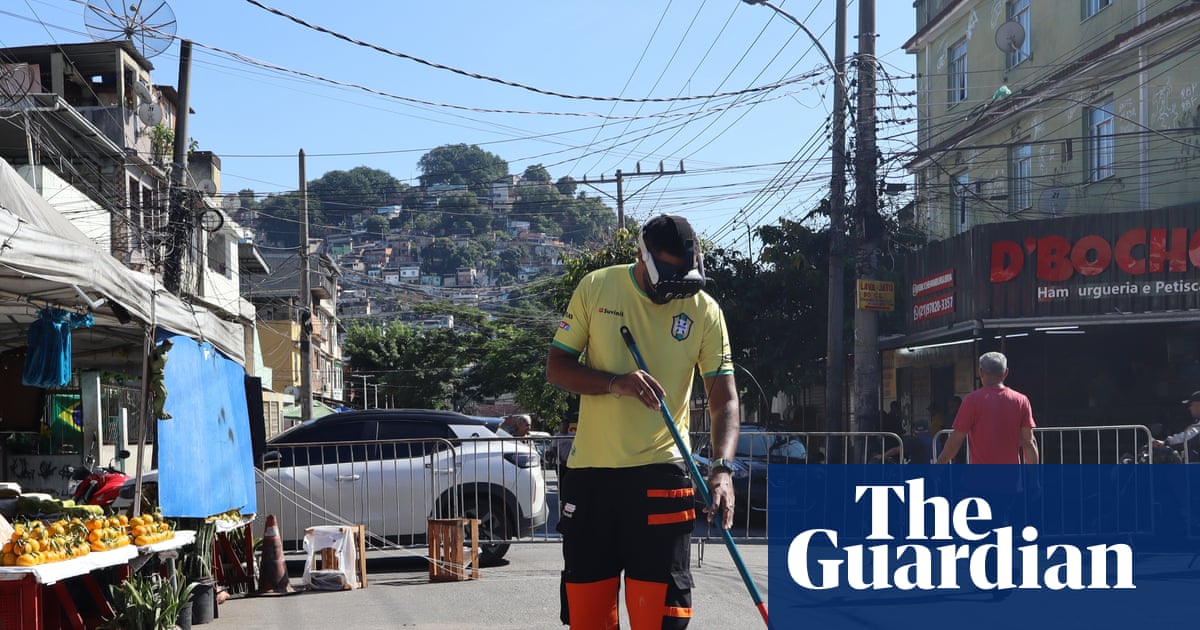 Brazilians paint streets to celebrate World Cup after deadly police raid: ‘Why not transform this place?’