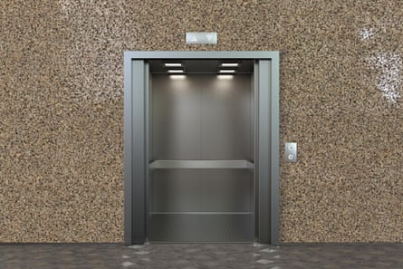 it is metallic silver inside and set in a pale brown stone wall.
