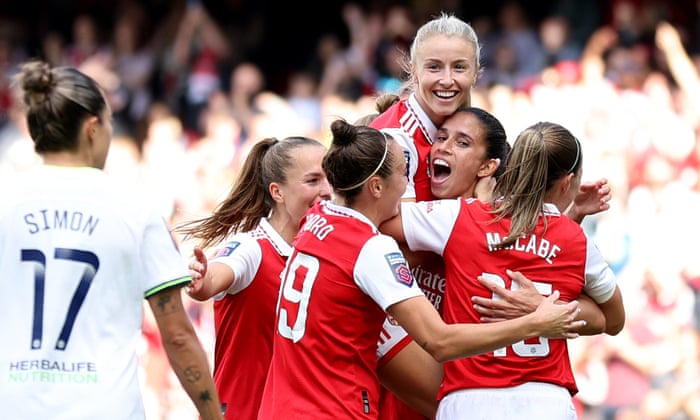 Rafaelle Souza of Arsenal (second right) celebrates with her team-mates after scoring their third goal.