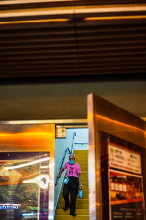 “A man in ‘I ♥️ HK’ shirt descends stairs in Wan Chai, Hong Kong. Geoff Dyer writes in his essay for the book how Hong Kong has a special affinity to Manhattan and how the cities have “a similar sense of intensely concentrated and vertiginous energy.”
