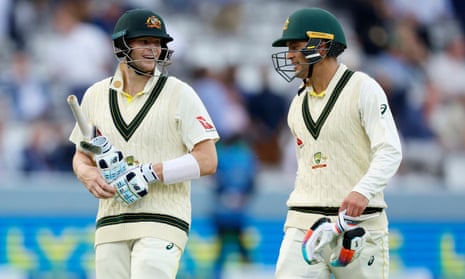 Australia's Steven Smith (left) and Alex Carey walk off the filed at stumps.
