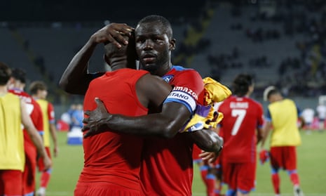 Kalidou Koulibaly celebrates Napoli’s victory at Fiorentina with teammate Victor Osimhen.