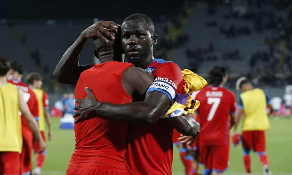 Kalidou Koulibaly celebrates Napoli’s victory at Fiorentina with teammate Victor Osimhen.