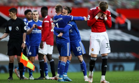 Leicester’s Marc Albrighton and James Maddison of Leicester City celebrate at full time as United’s Brandon Williams looks dejected.