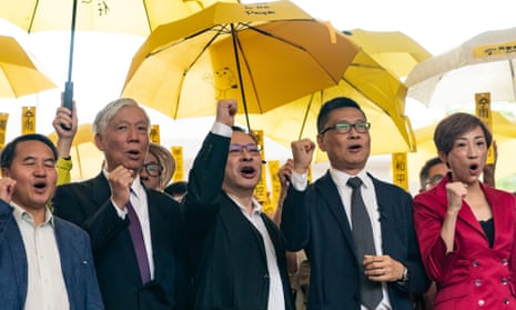 Hong Kong democracy activists Lee Wing-tat, Chu Yiu-ming, Benny Tai, Chan Kin-man and Tanya Chan hold a rally outside West Kowloon court on Monday.