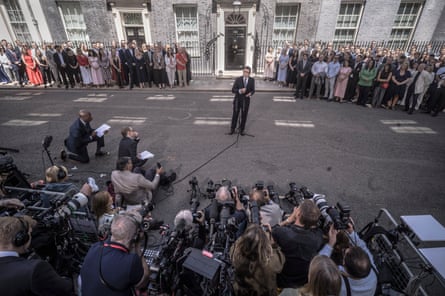 Andy Burnham gives a speech outside No 10 with crowds of journalists and government staff stood nearby