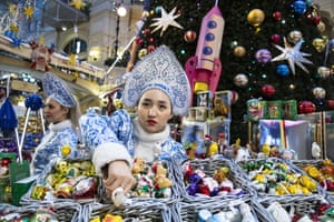 A vendor dressed as Snegurochka (The Snow Maiden) in the GUM State Department store. Moscow, Russia