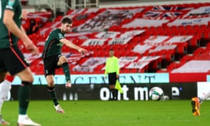 Davies scores a long-range effort.
