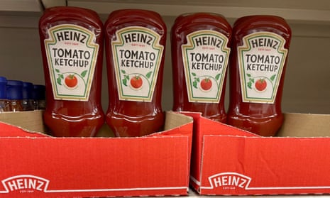 Plastic bottles of Heinz tomato ketchup on a supermarket shelf