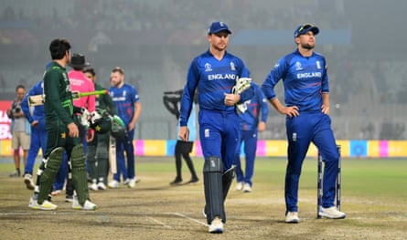 Sombre scenes as Jos Buttler and Dawid Malan walk off the pitch after England’s World Cup defeat against Pakistan in November 2023