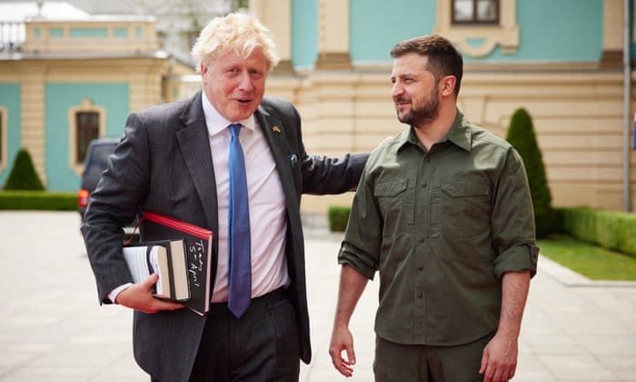 This handout picture taken and released by Ukrainian Presidential Press-Service on June 17, 2022, shows Ukrainian President Volodymyr Zelensky (R) welcoming Britain’s Prime Minister Boris Johnson, before talks in the Ukrainian capital Kyiv.