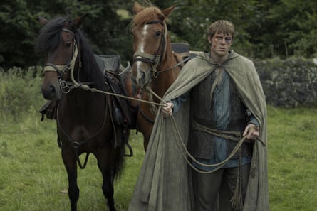 Dunk, with a heavily bruised face, leads two horses