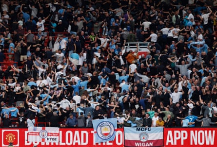 Manchester City fans celebrate after the match at Manchester United in September